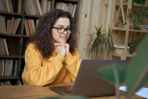 Hispanic teen girl in an online therapy session.